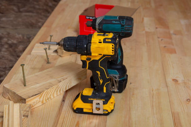 istock Carpenter's tools on a new wooden plank floor. 1982622949