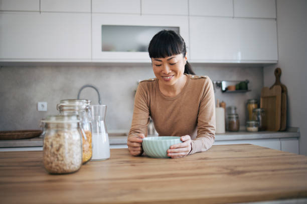 istock Japanese woman eating at the kitchen 1982629277
