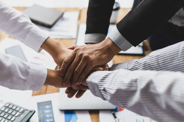 istock Collaboration and unity of people in an organization. 1982629304