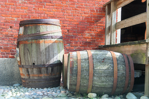 Two large wooden barrels outside the custom house in salem massachusetts.