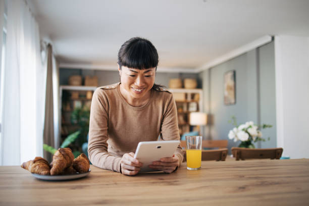 istock Japanese woman using digital tablet 1982633747