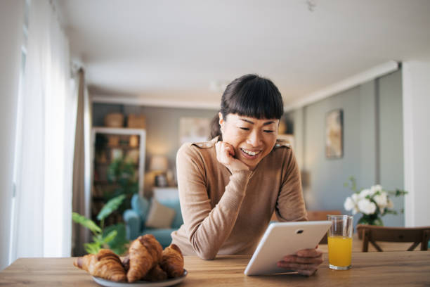 istock Japanese woman using digital tablet 1982634305