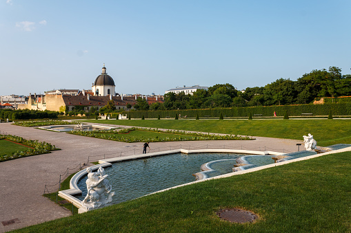 The fountain and the elegant symmetric gardens of the Belvedere palace in Vienna, Austria