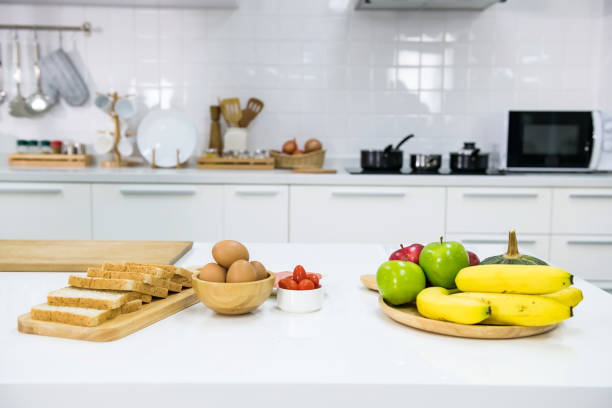 istock Sandwich preparation in kitchen  for morning breakfast eating 1982641750