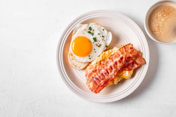 istock Breakfast sandwiches with fried egg, bacon and scrumble 1982685982