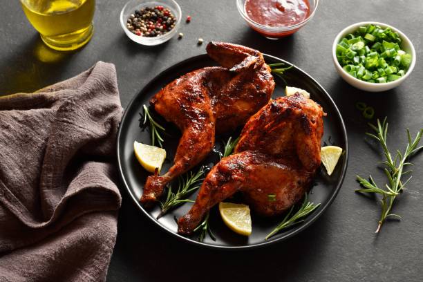 istock Grilled half chicken with lemon and rosemary 1982691428