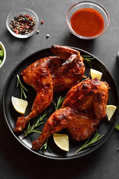 istock Grilled half chicken with lemon and rosemary 1982691938