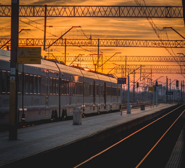 istock the sun setting over the train at the railway station 1982695117