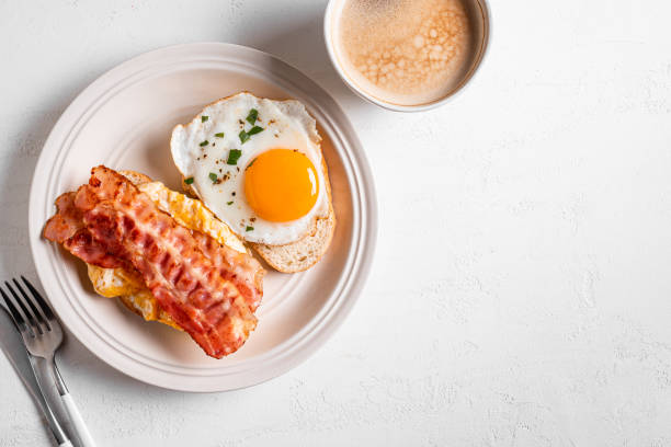 istock Breakfast sandwiches with fried egg, bacon and scrumble 1982707215
