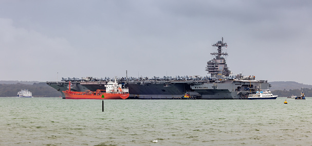 Portsmouth, UK - 16th November 2022: The USS Gerald R Ford Aircraft Carrier at anchor near to Portsmouth UK during a visit