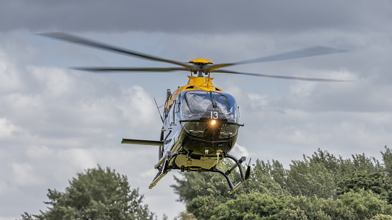 Cosford, UK - 12th June 2022:  A Eurocopter EC 135T1 taking off from the airfield, low and closeup