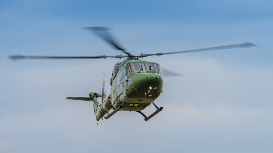 Cosford, UK - 12th June 2022: A Vintage helicopter Westland Lynx Mk7 flying close to ground