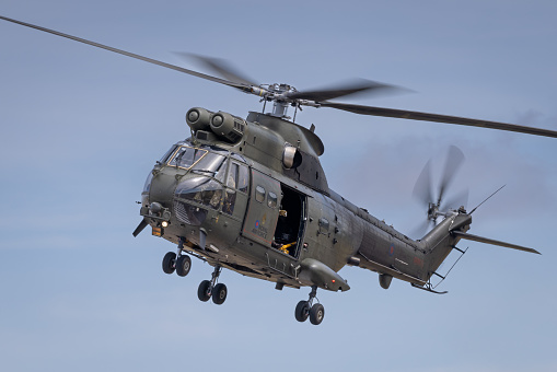 Fairford, UK - 14th July 2022: An RAF Helicopter Puma HC2 inflight close to the ground. Close up