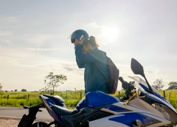 istock Man and his motorcycle in a rural place. 1982720329
