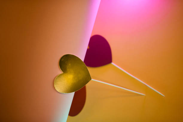 Heart-shaped paper cutouts. Valentine's Day template. Pastel colors. Colorful background. Toppers.