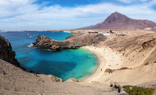 Aerial view of Playa de Papagayo beach, with blue clean water and white sand, this is one of the most beautiful place in Lanzarote, Canary Islands - Spain