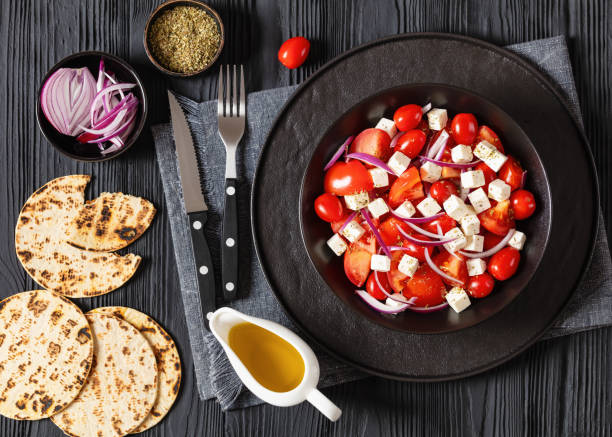istock tomato salad with red onion and white cheese 1982830710