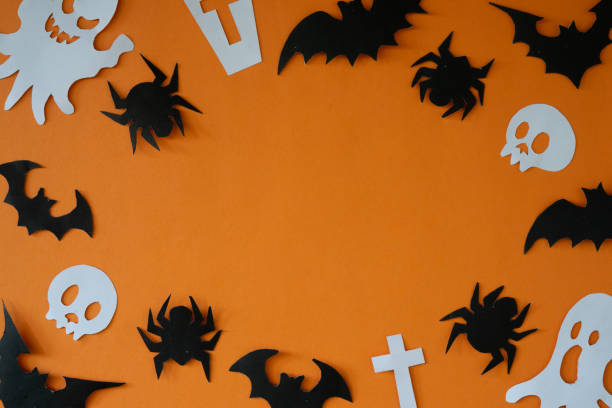 istock halloween background with cut out paper frame 1982846349
