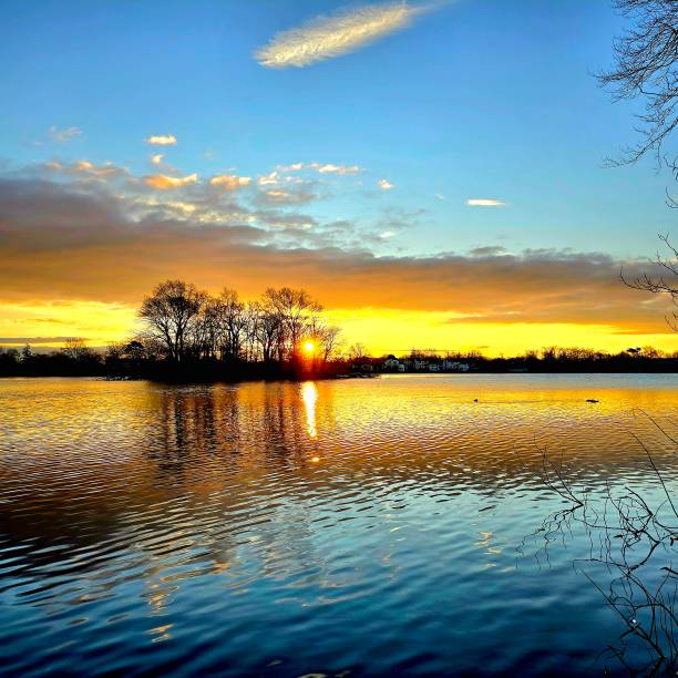 istock Sunrise at the lake with clouds 1982847399