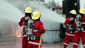 Firefighting Team In Strategic Formation During Combative Fire Control ...