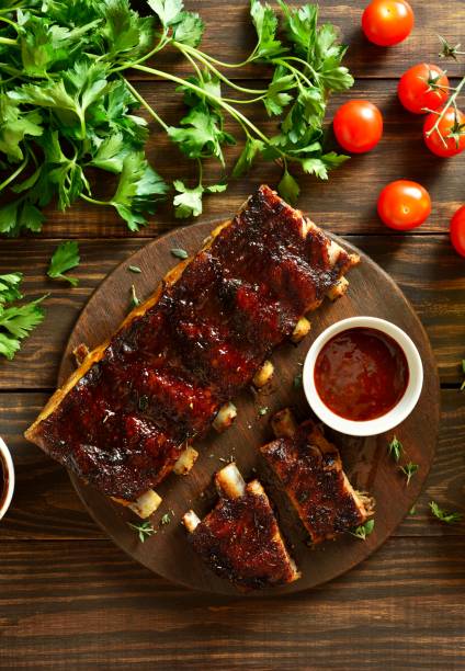 istock Barbecue pork ribs on cutting board 1982867494