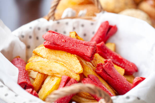French fries and deep fried sausage on traditional Turkish breakfast table.