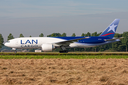 Hoofddorp, Netherlands - August 4, 2009: LAN Cargo Boeing 777F with registration N774LA rolling on taxiway V of Amsterdam Airport Schiphol