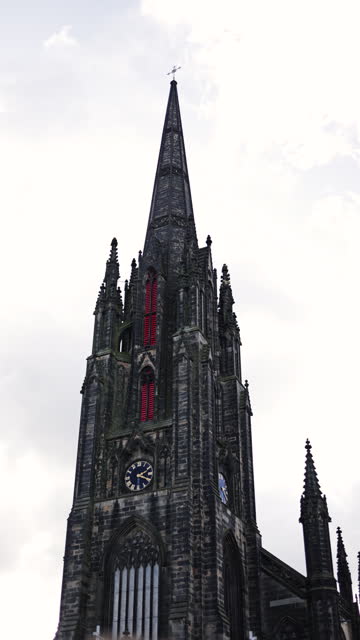 View of Tolbooth Kirk Church in Edinburgh, Royal Mile in Edinburgh, The Hub high spire church in Edinburgh city centre, Gothic Revival architecture in Scotland