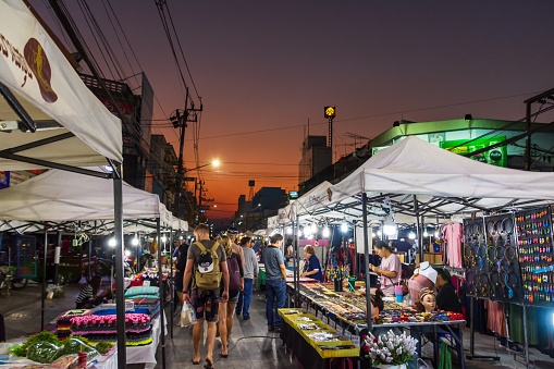 People shopping at the night market in Chiang Rai, Thailand