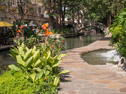 Scenic waterside promenade in San Antonio, Texas, USA, offering a delightful pathway to stroll along the tranquil waterway.