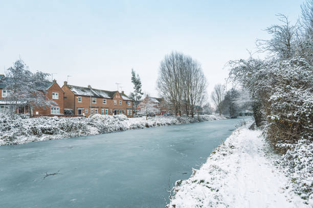 Narrow boat on the Bridgewater canal during cold weather in England