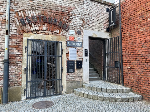 Olomouc, Czech Republic - January 30, 2024: Entrance to the restaurant located in the old building.
