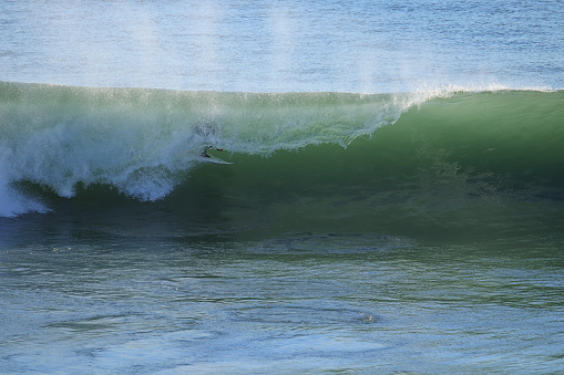 Surfer on perfect Wave . Surf spot in Ericeira Portugal