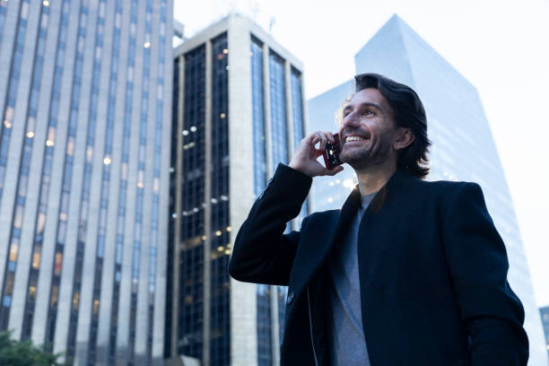 istock View of young man using a smartphone at twilight 1983013347