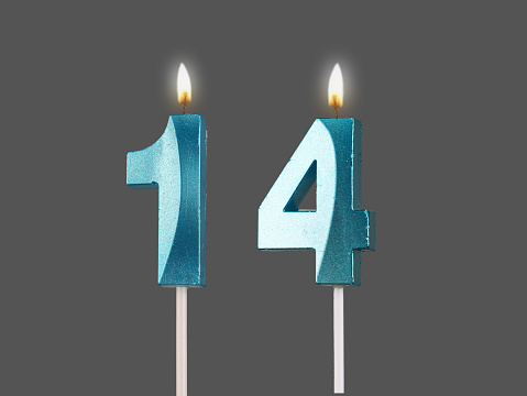 14 birthday, number candles with light, isolated on white background