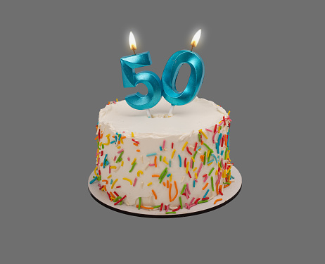 50 shaped candle light on happy birthday cake isolated on white background