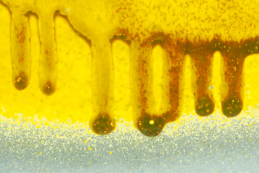 Drops of yellow paint applied with a spray can