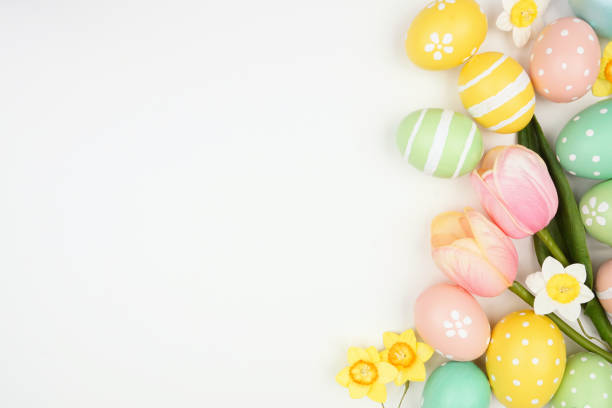 istock Easter eggs and flower decoration side border against a white banner background 1983055656