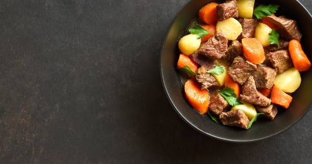istock Beef stew with potatoes, carrots and greens 1983074135