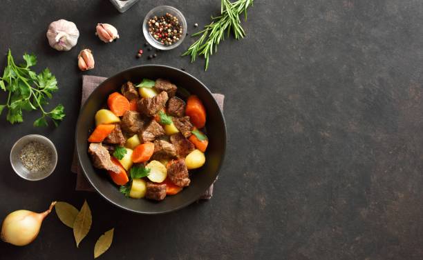 istock Beef stew with potatoes, carrots and greens 1983074150
