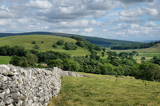 Drystone wall and view looking south over towards Kail Hill near Burnsall, in the Yorkshire Dales, North Yorkshire.