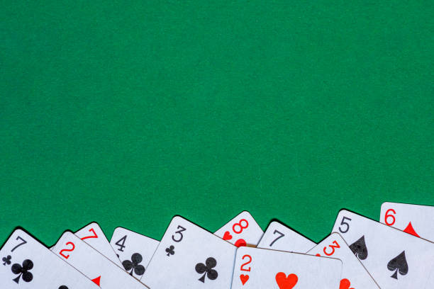 istock Playing cards on green background 1983077795
