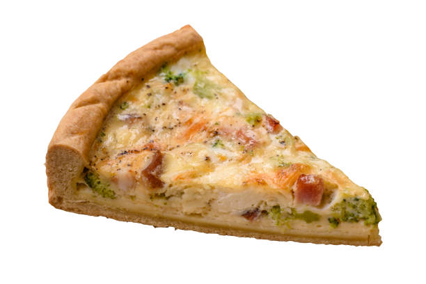 Delicious quiche with broccoli, cheese, chicken, spices and herbs on a dark concrete background