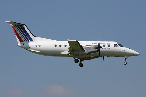 Schiphol, Netherlands - July 24, 2008: Regional Embraer EMB-120 Brasilia in Air France livery with registration F-GHIA on final for Amsterdam Airport Schiphol