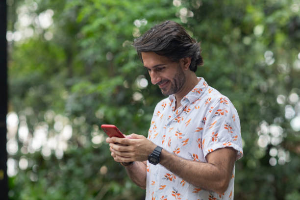 istock View of young man using a smartphone at twilight 1983097051