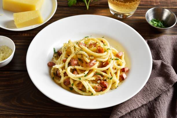Carbonara pasta, spaghetti with crisp pancetta bacon and black pepper