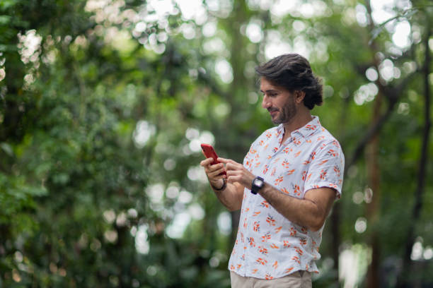 istock View of young man using a smartphone at twilight 1983124380