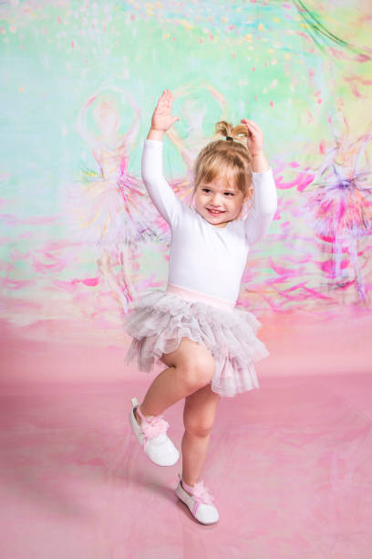 istock Cute Little Ballerina Doing Exercises Set in the studio 1983157775