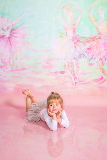 istock Cute Little Ballerina Doing Exercises Set in the studio 1983158804