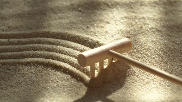 Close-up making sand zen garden
